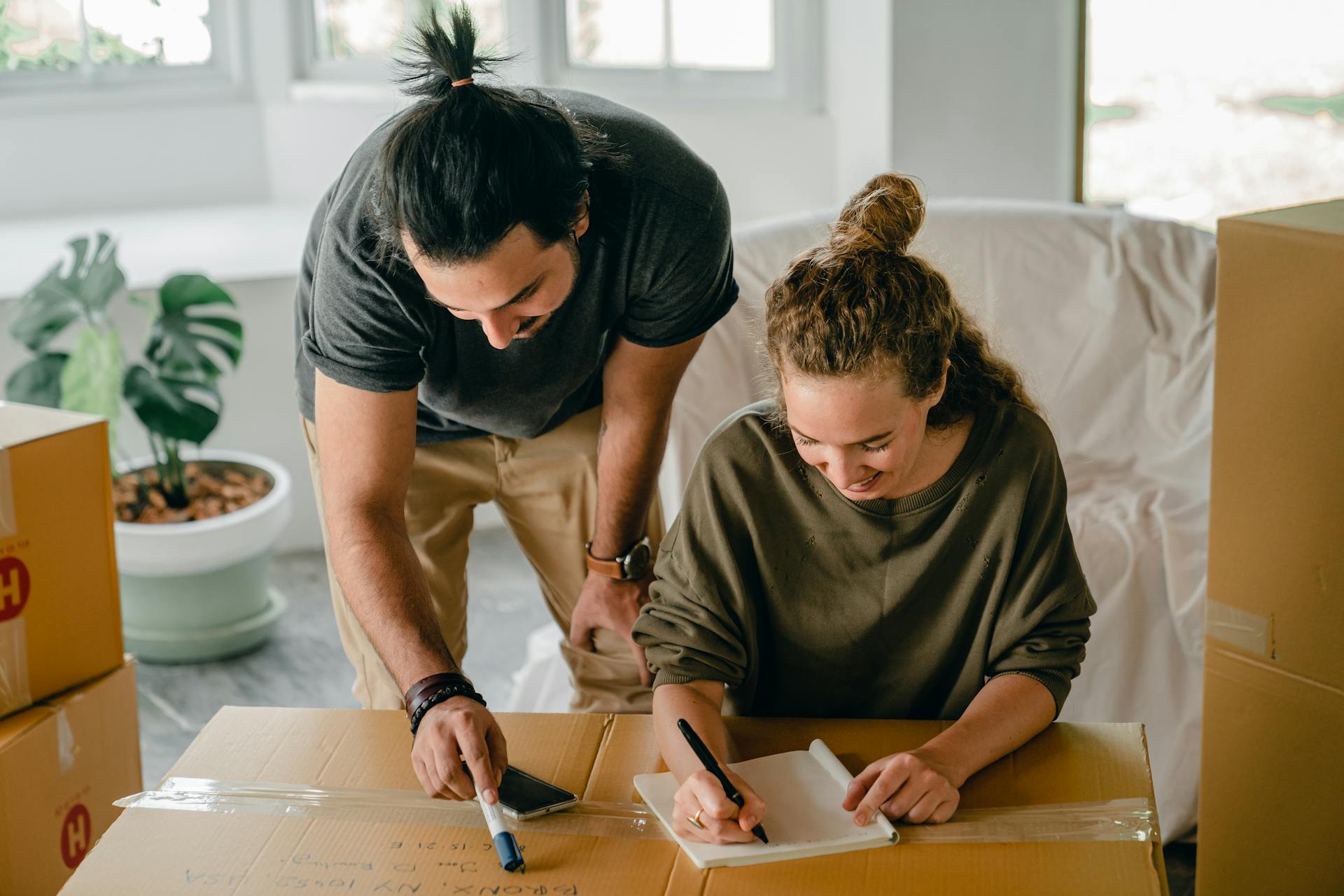 Man and woman planning house move